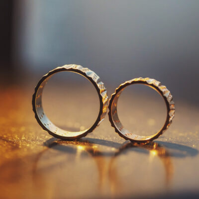 Wedding rings solo on the woden table